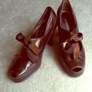 Chocolate patent leather ribbon-tied heels