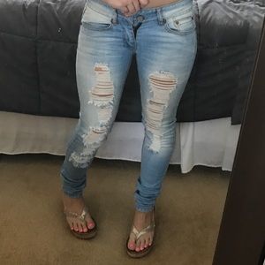 Indigo Rein light wash destroyed skinny jeans