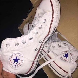 White high-top converse.