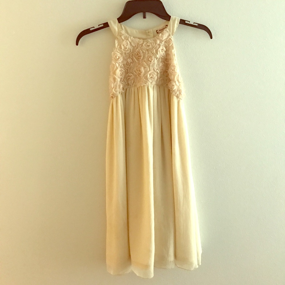 A cream chiffon above the knee dress