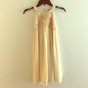 A cream chiffon above the knee dress