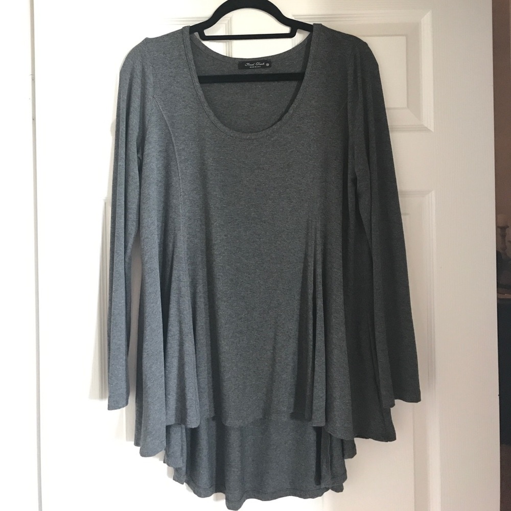 Final touch high-low trapeze top