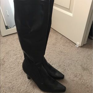 Tall black faux leather boots