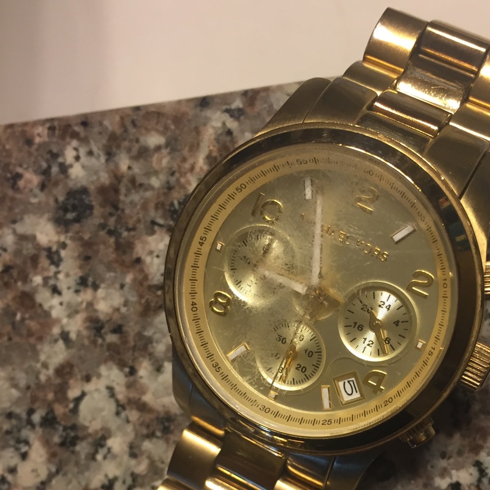 Scratched face gold Michael Kors watch