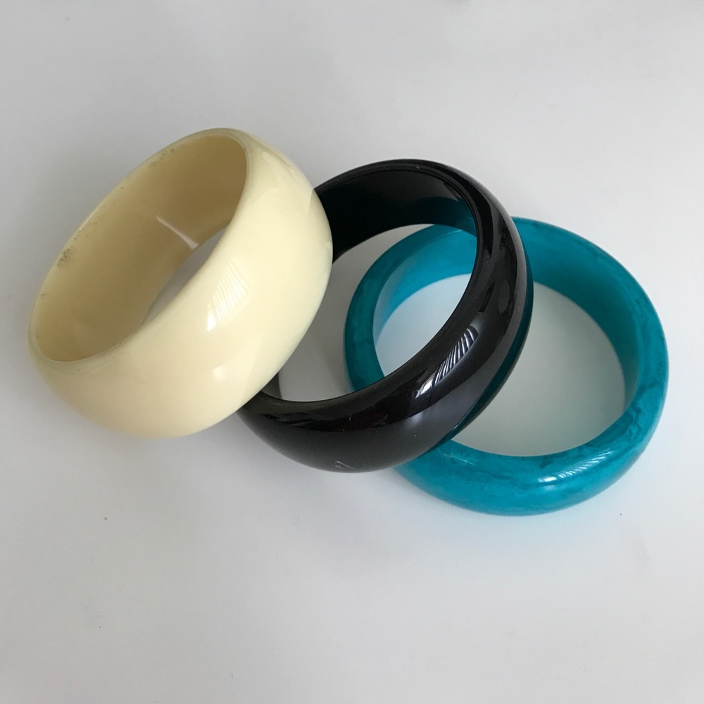 Three plastic bangle bracelets