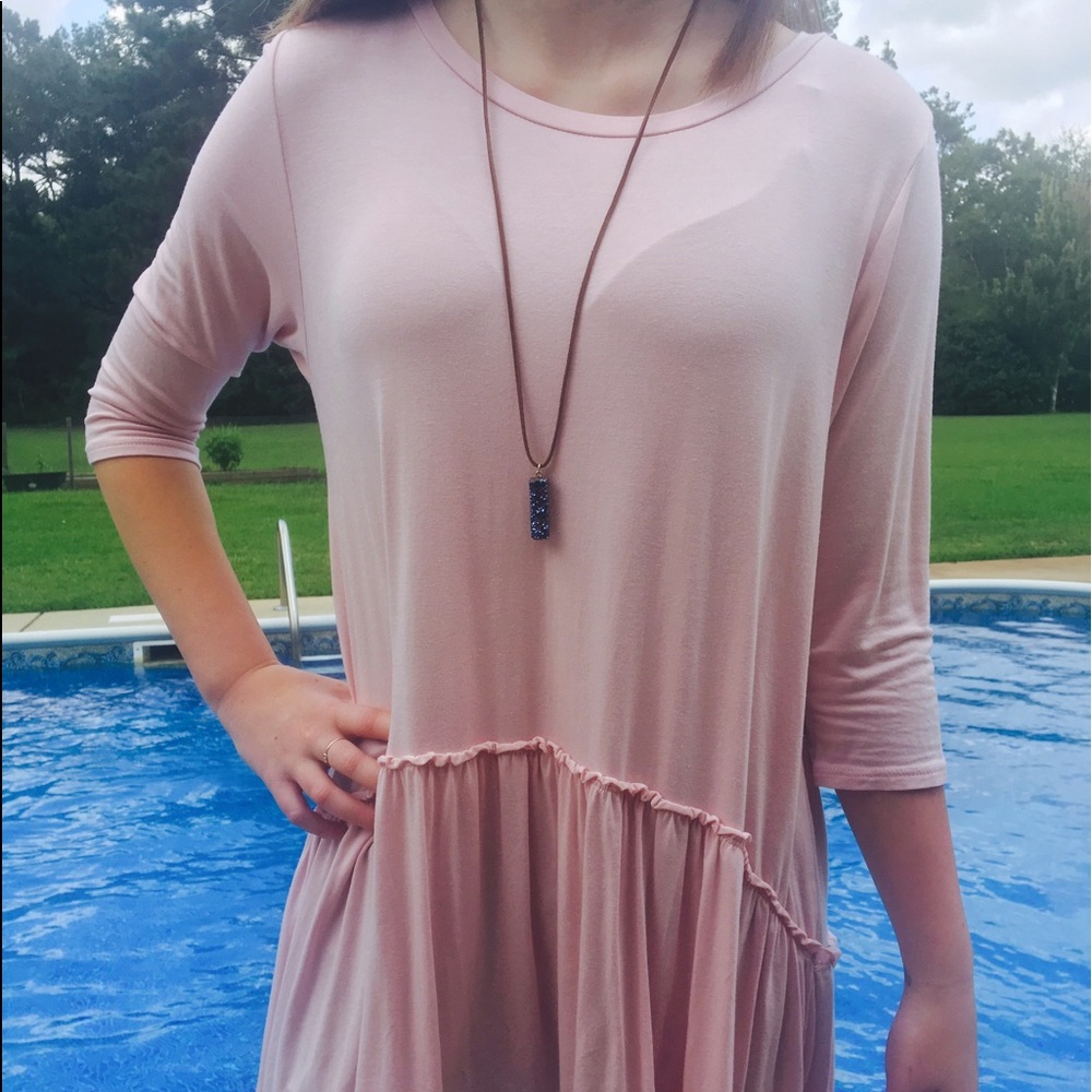 Blush top with asymmetrical hem