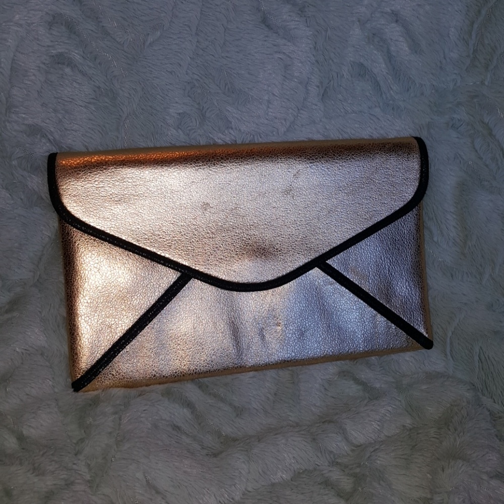 Gold clutch with Black pipping