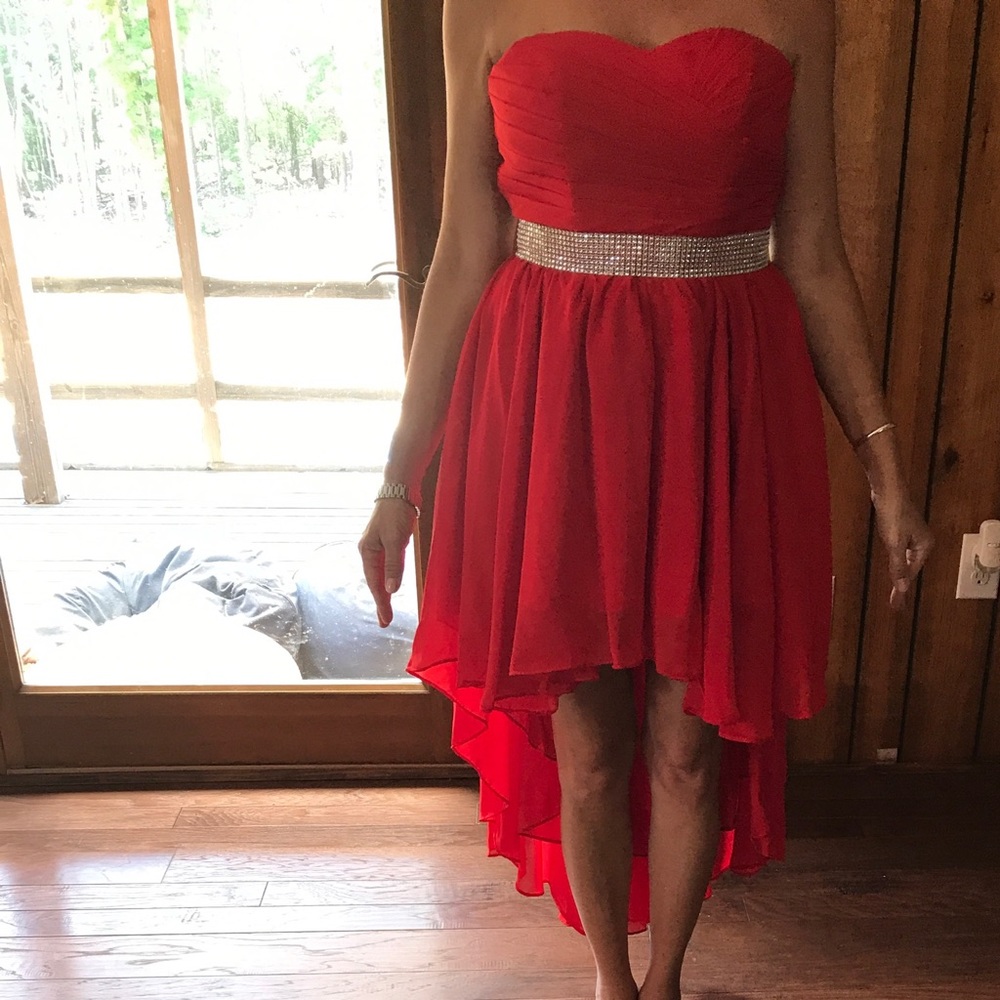 Red, high-low evening gown, lace up back.