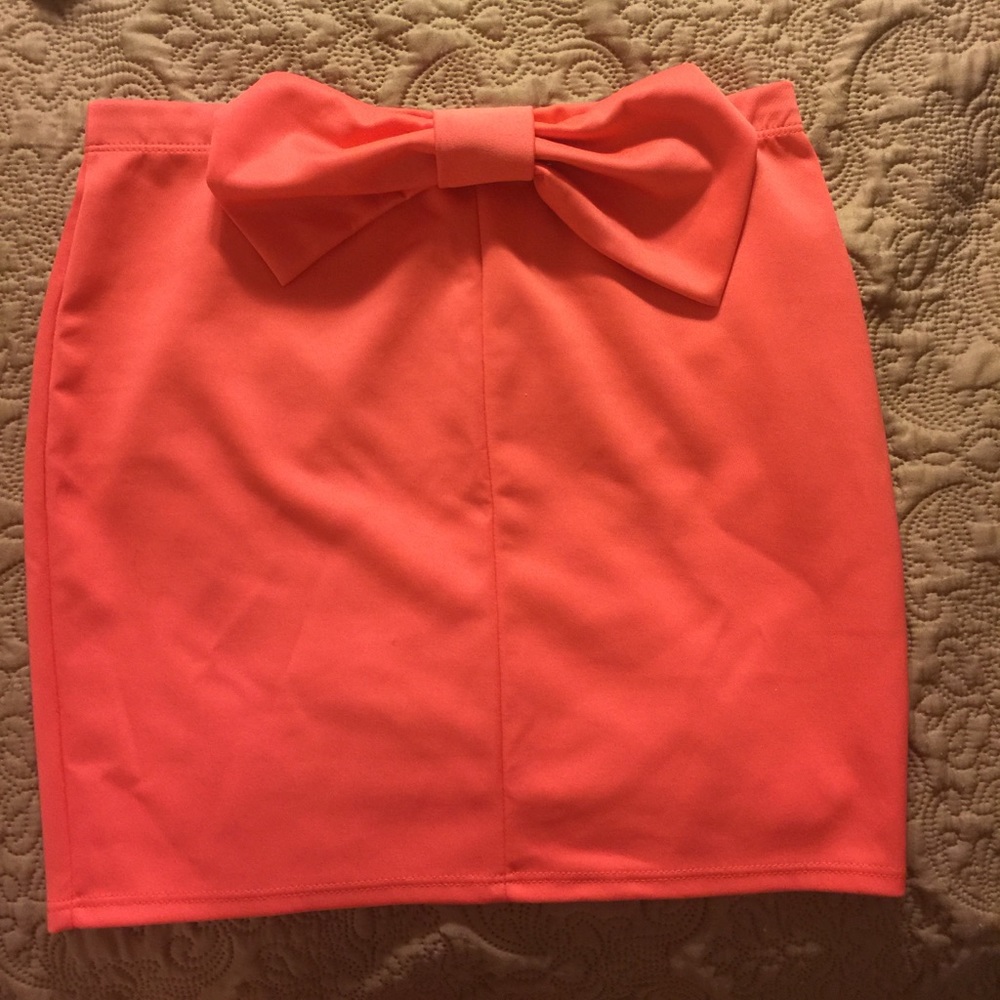 Salmon colored skirt with bow in the back