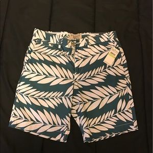 Green shorts with white leafs.