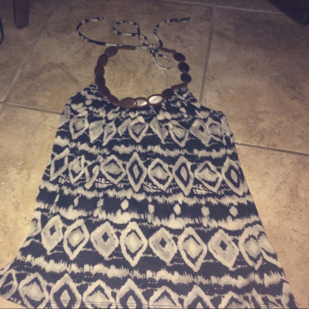 cute tank top kinda shirt has wood around neck.