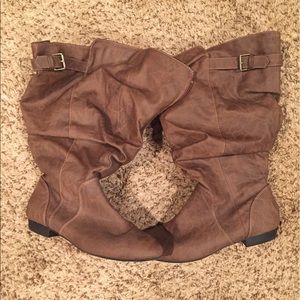 Brown mid calf wide leg boots.