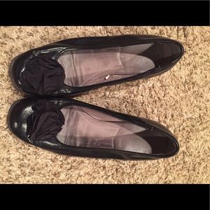 Black pleather wedge heel with flower.