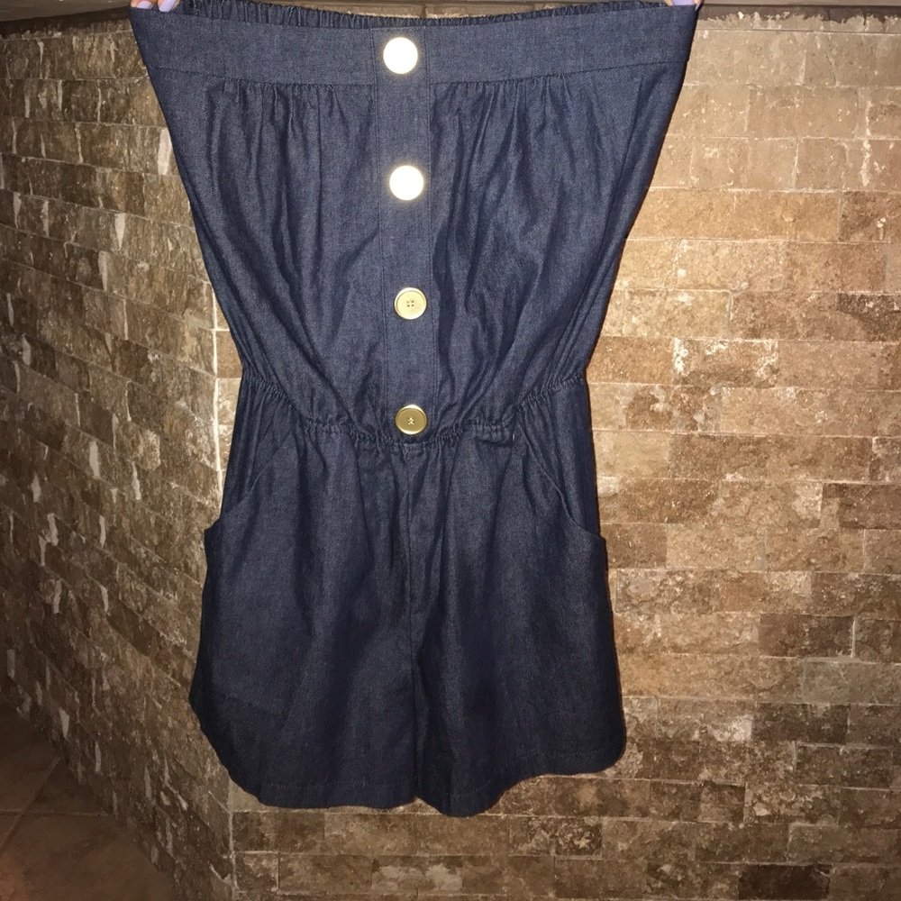 Jean romper with a gold button accents