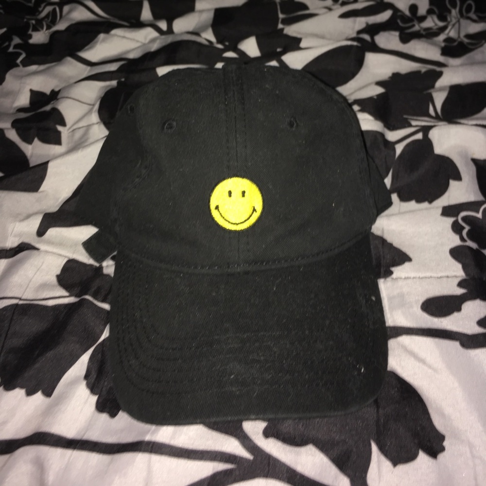 Black hat with a happy face patch