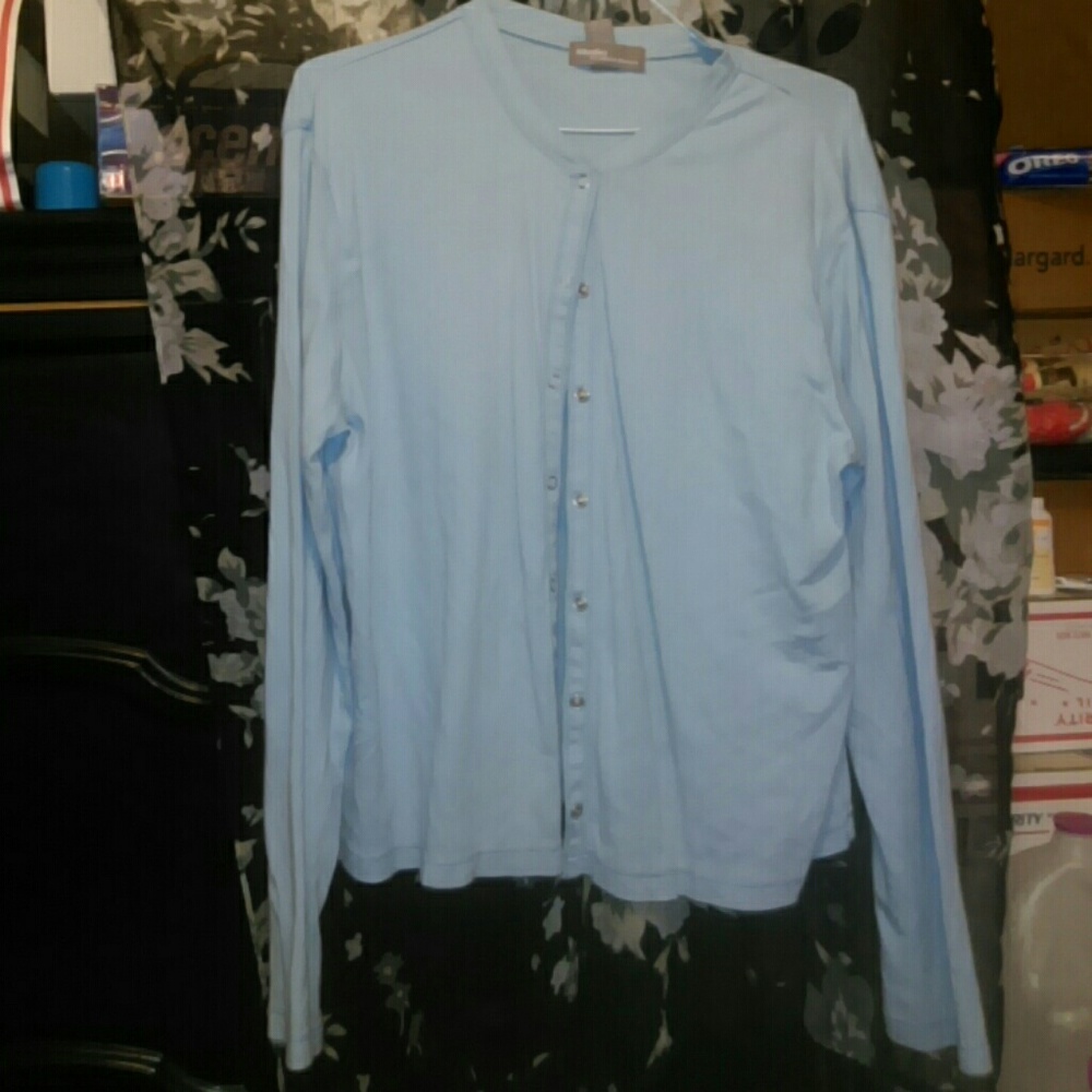 Pale blue cardigan. Snap closure.