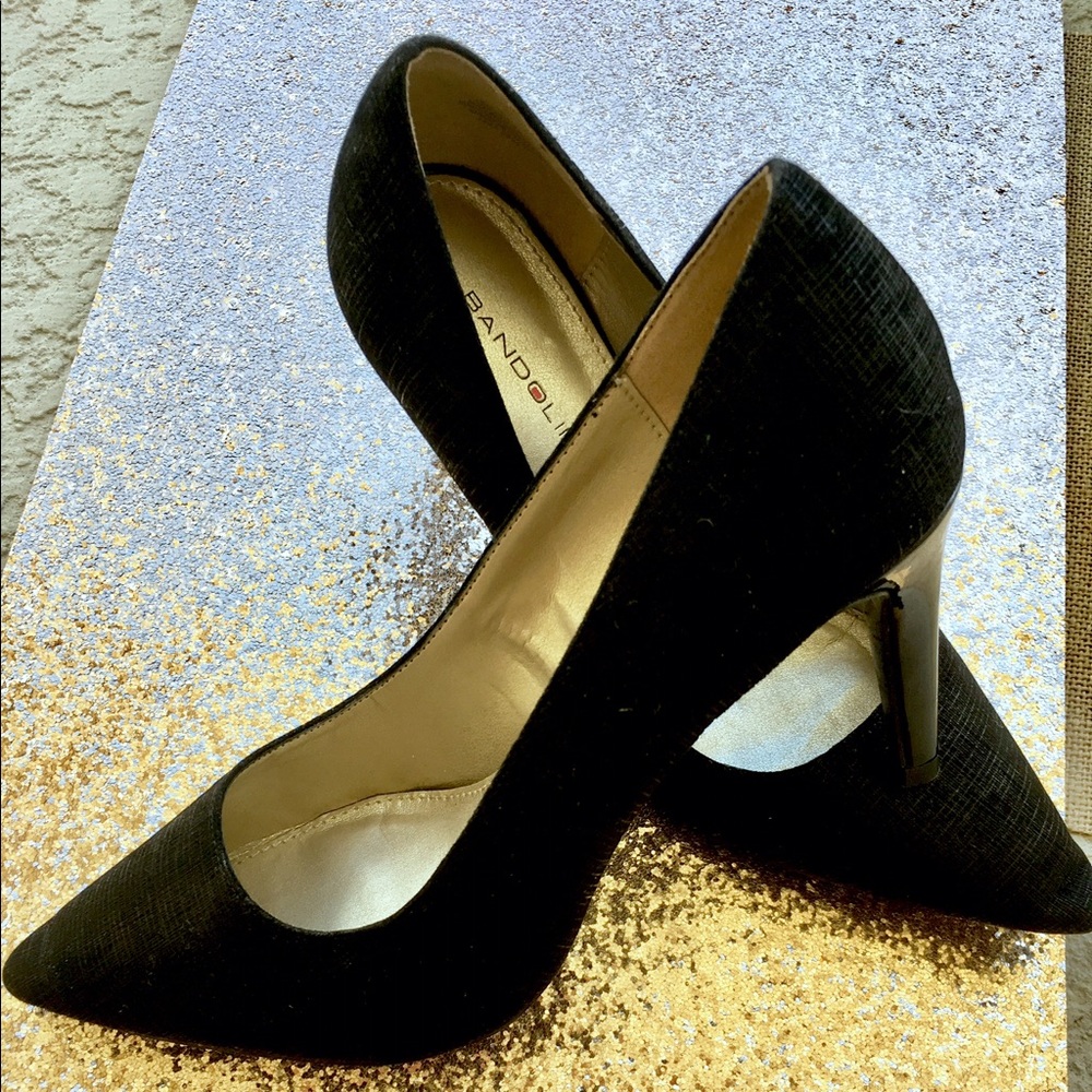 Black suede like stiletto with patent heel.