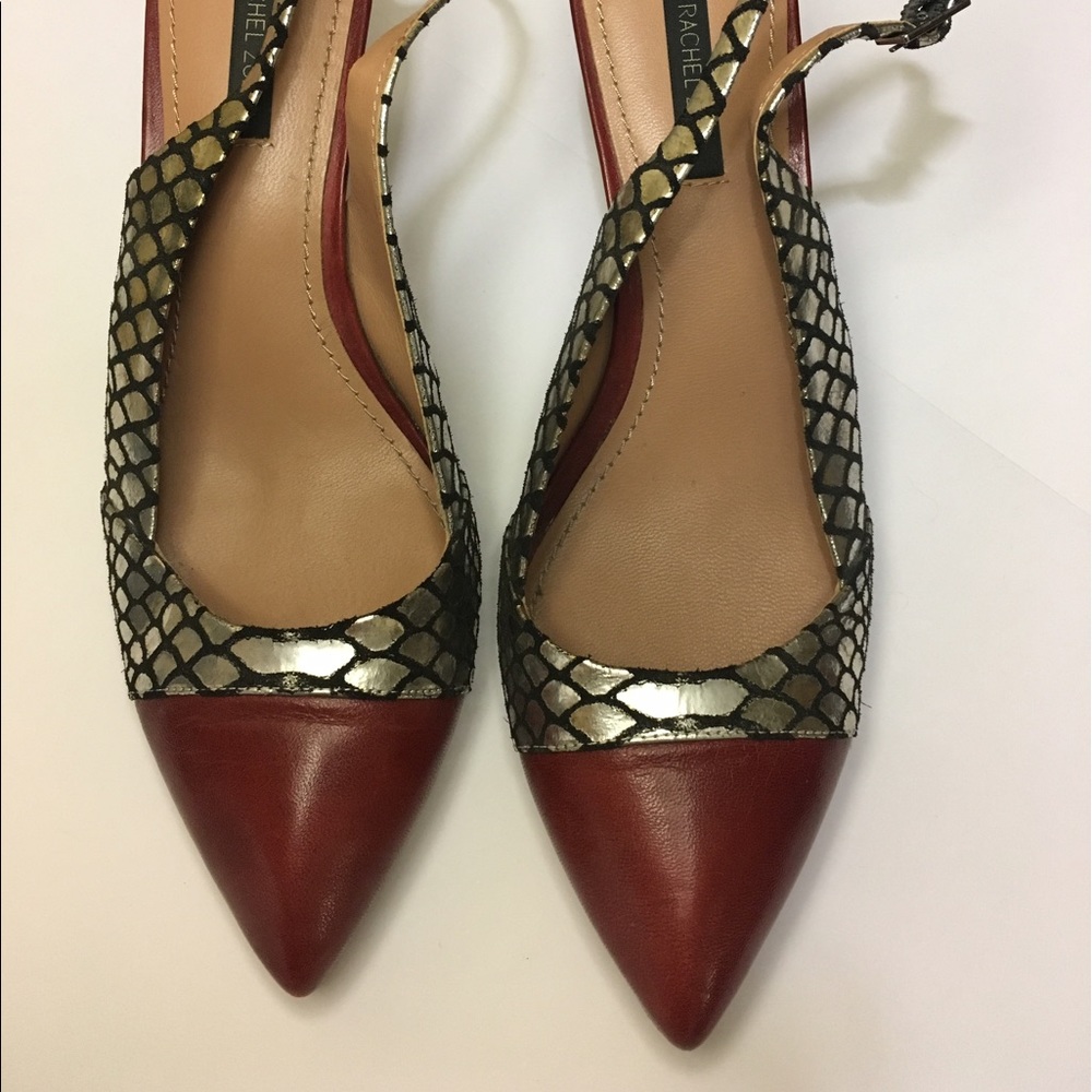 Low, strappy, silver snake and red heels