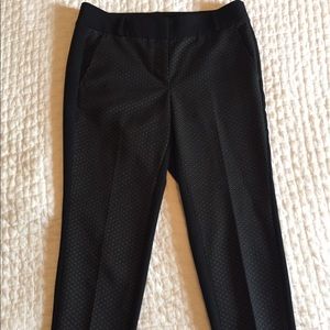 Black crop pants with gold dotted pattern on front