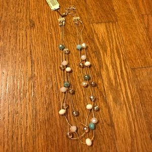 Three strand gold beaded necklace