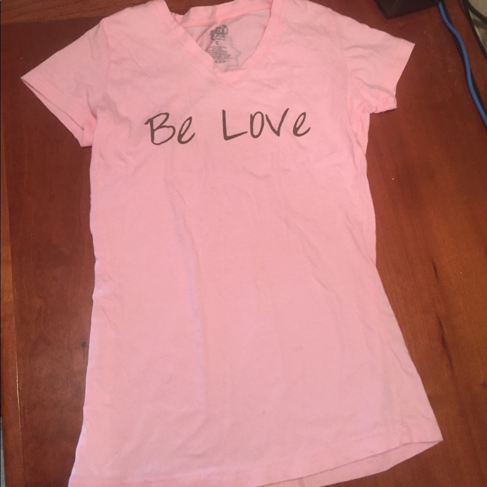 A pink "be love" shirt