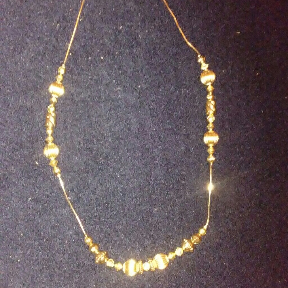 Gold necklace.