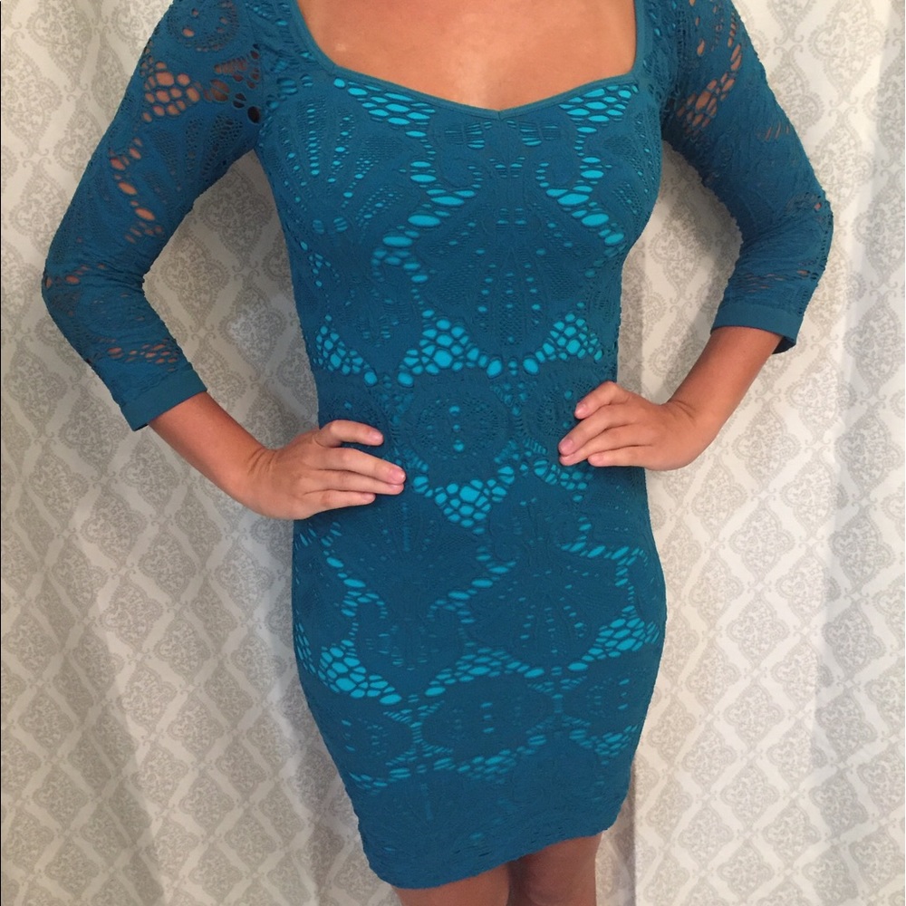 NEVER WORN.Stretchy Material. Sz Medium.Teal Dress