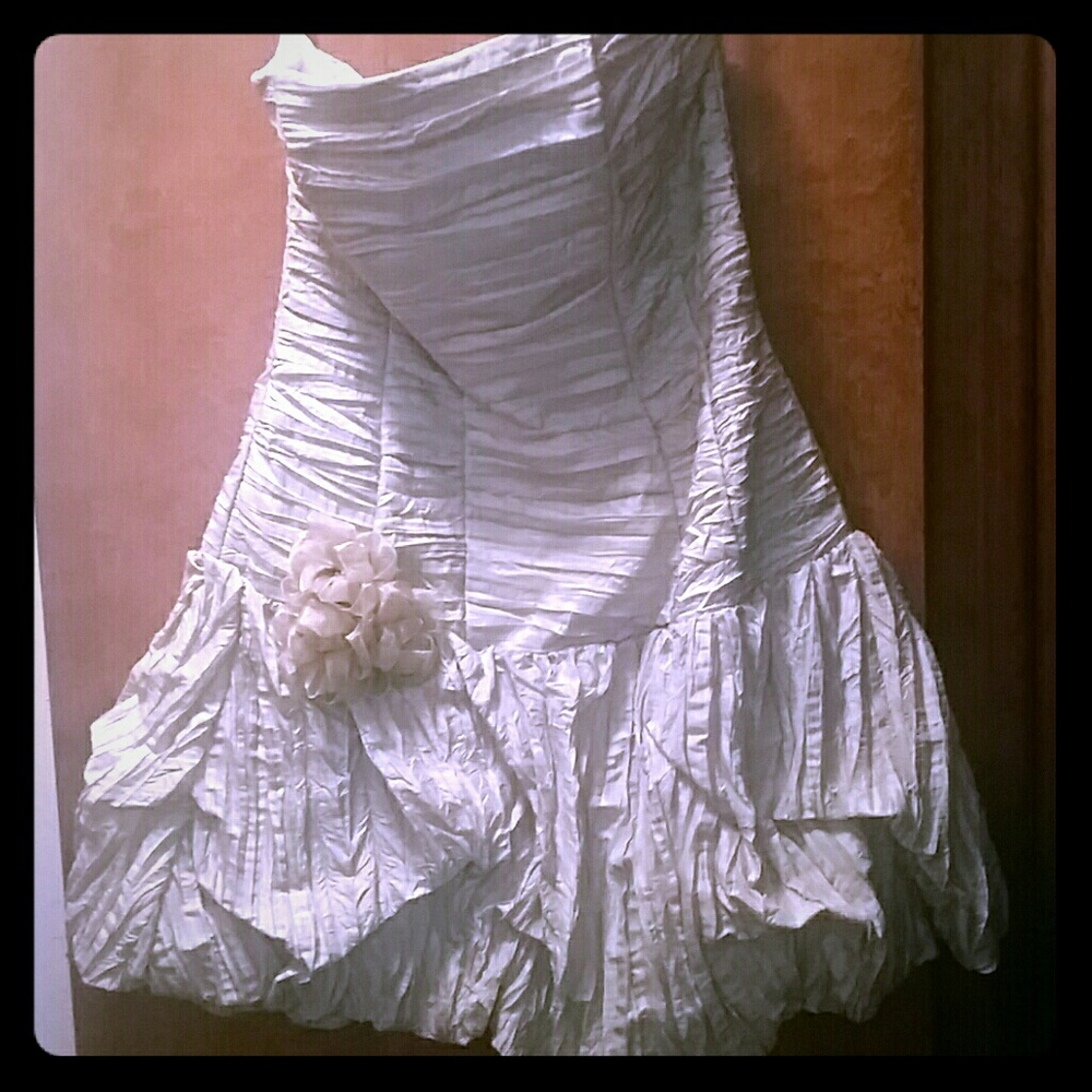 Light green strapless ruffle dress.