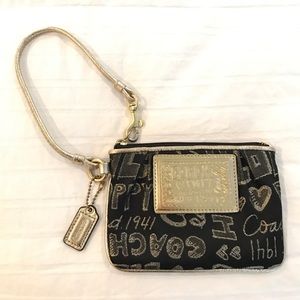 Coach Poppy Signature Wristlet in Black and Gold