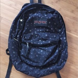 Black Jansport book bag with stars