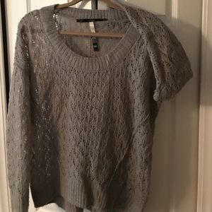 Gray sweater. Cut outs, a bit sheer.