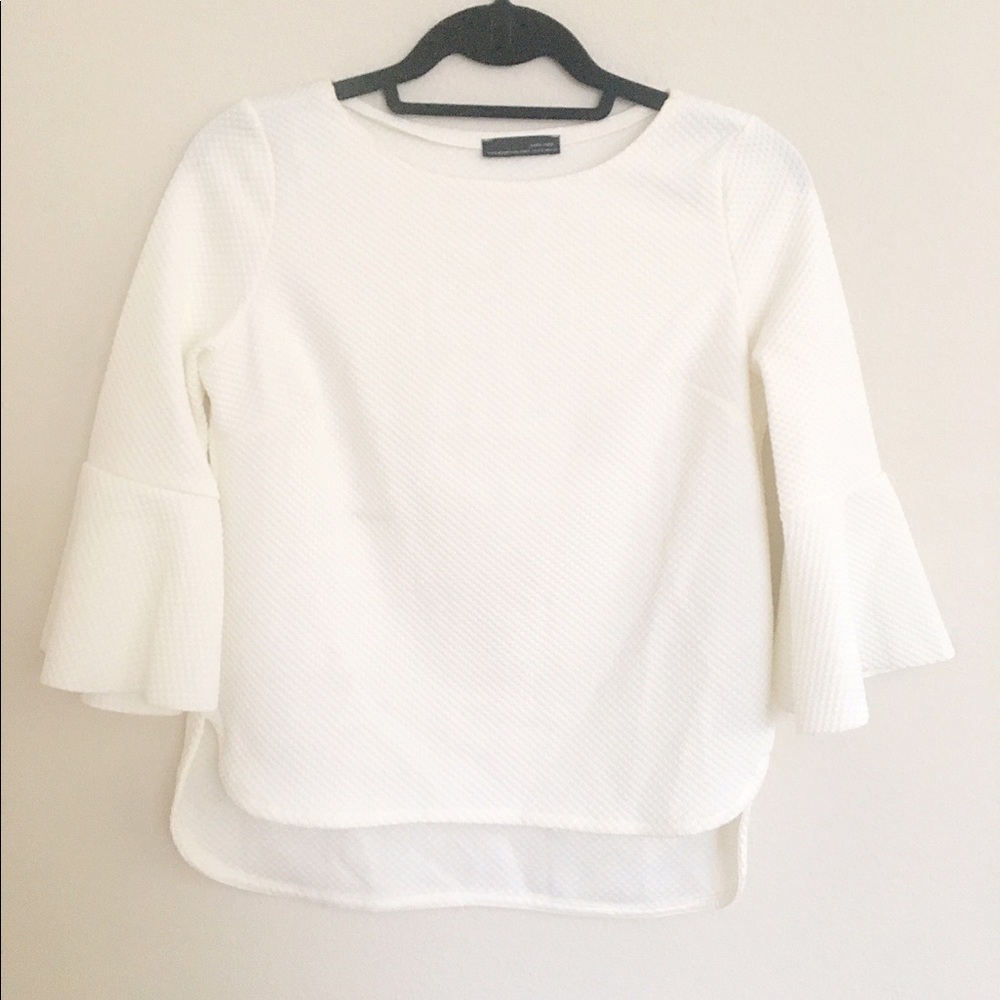 Textured white top with bell sleeves