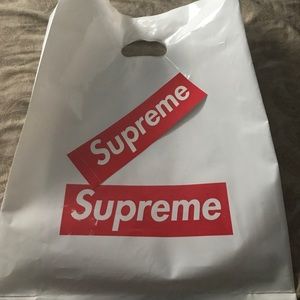 2 Supreme dust bag and 1 sticker.