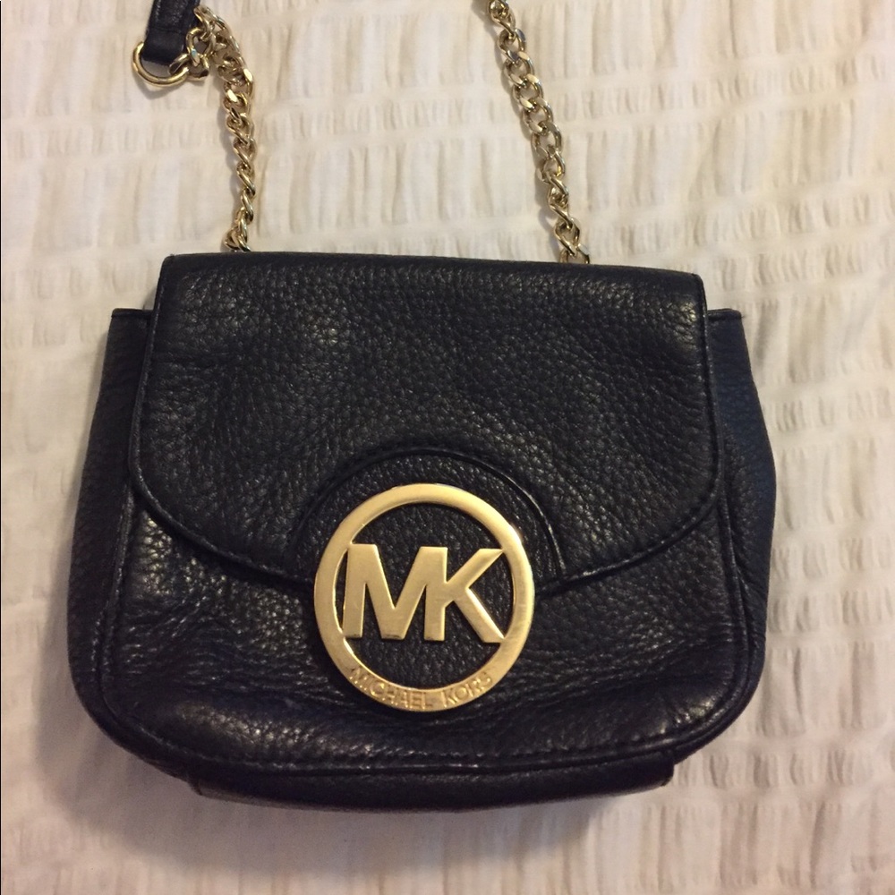 Michael Kors cross body black and gold bag.