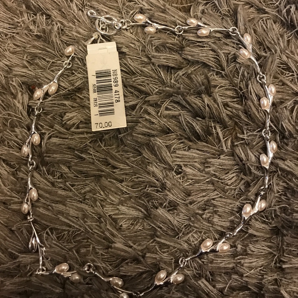 New necklace silver color with pearls.