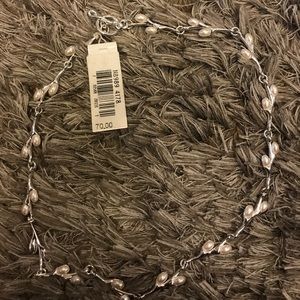 New necklace silver color with pearls.