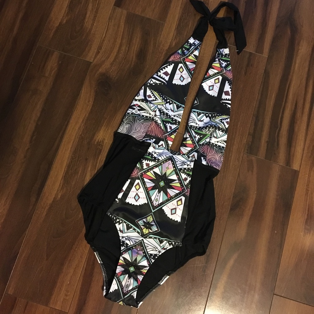Plunge halter tie one piece swimsuit. Mesh sides.