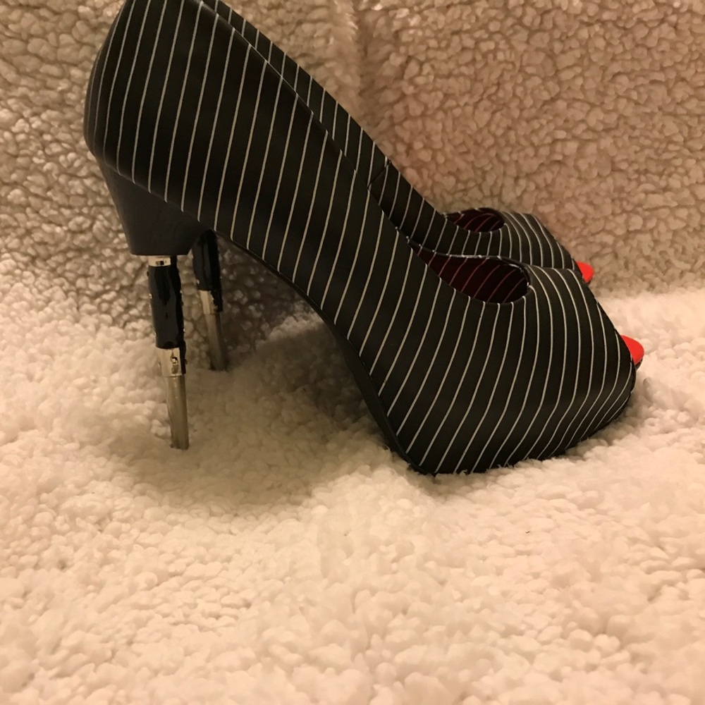 Pin strip high heels with a switch blade heel