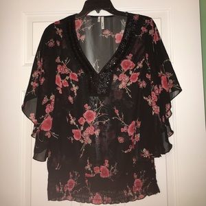 Floral dressy blouse with beaded neck and smock.