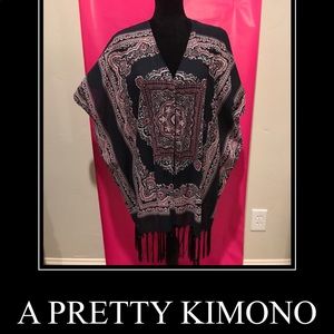 A pretty kimono. Stylish over light top.