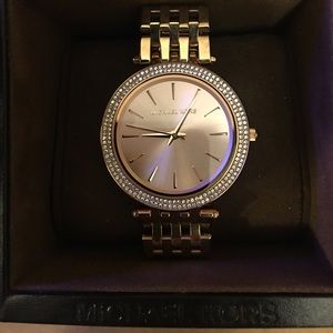 Rose gold women's Michael Kors watch.