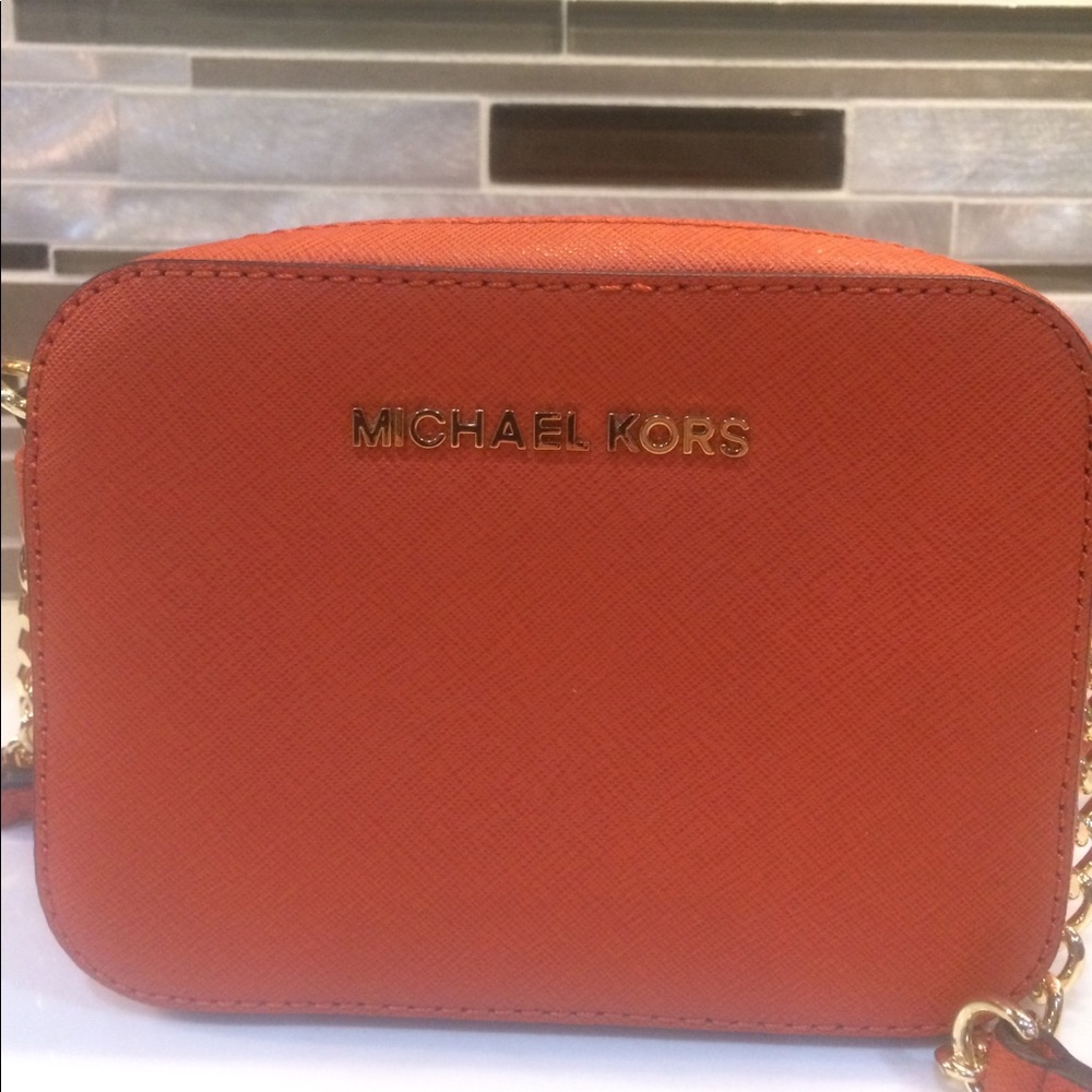 Michael Kora orange mini purse