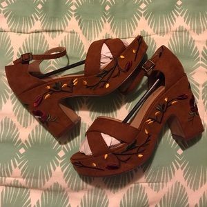 Brown heels with flower accents