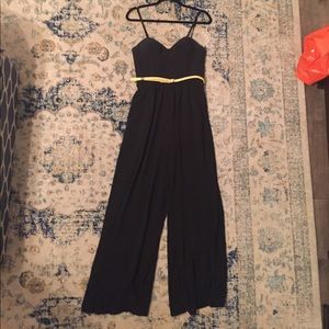 Black jump suit with yellow belt