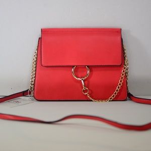 Red clutch handbag with hardware