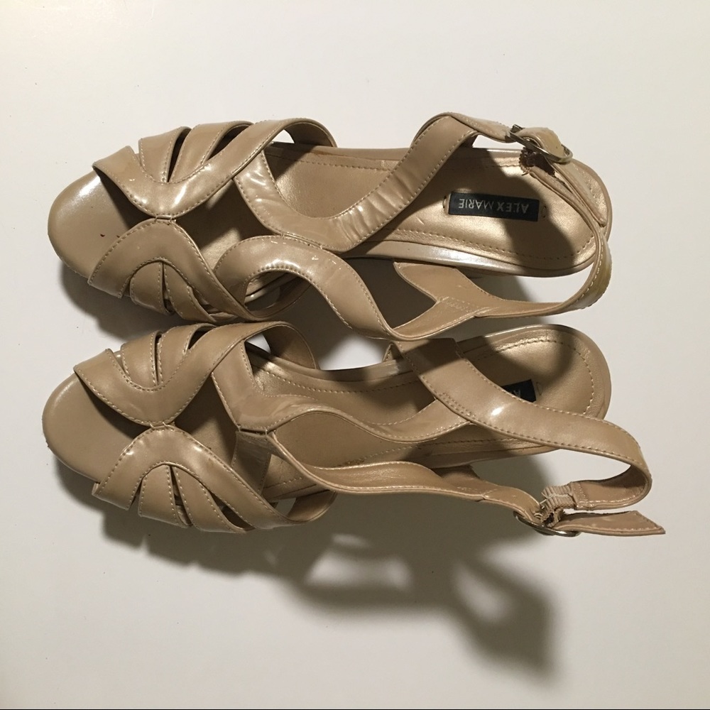 Light tan colored wedge sandals.