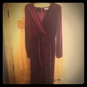 A burgundy velvet long sleeve evening dress