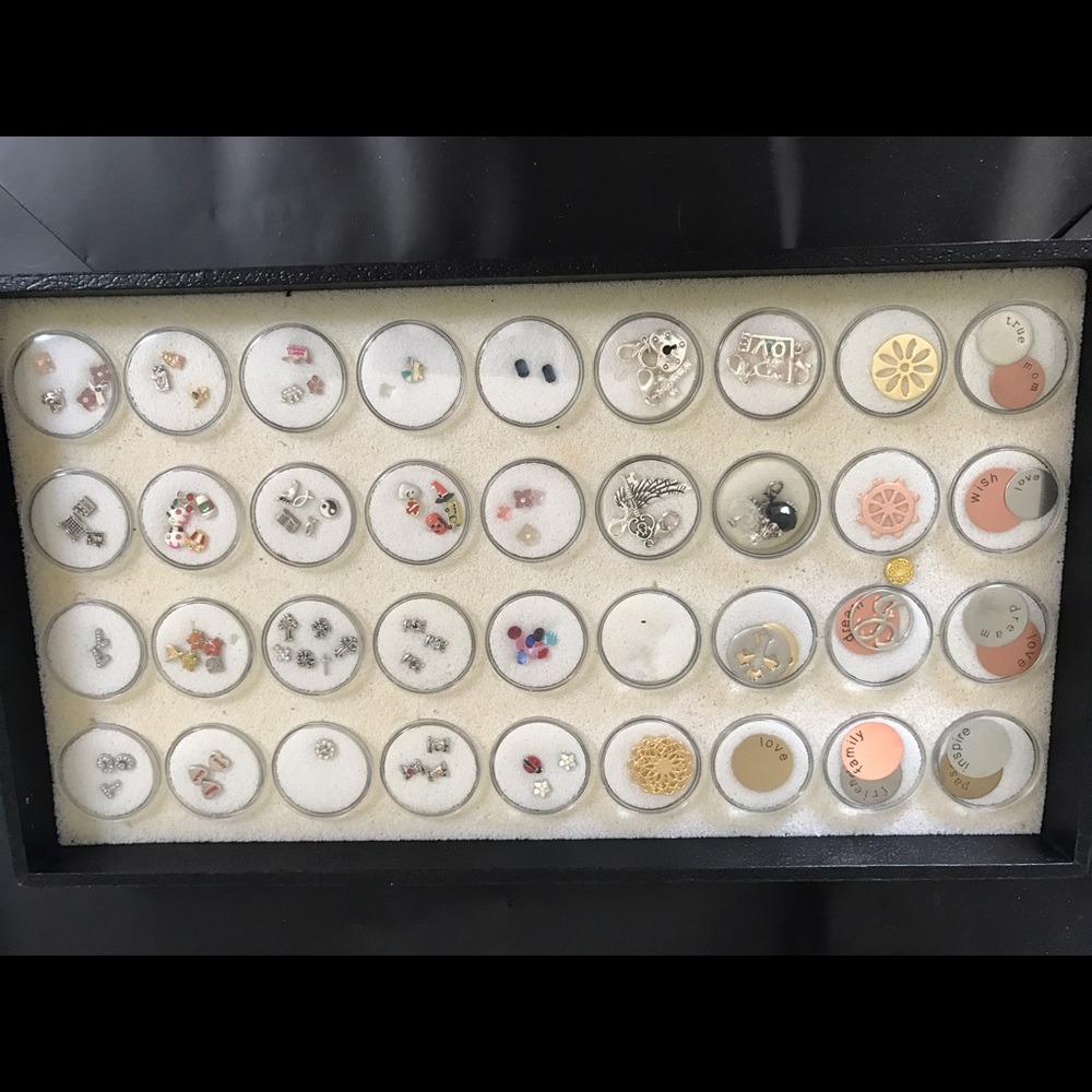 Several charms for lockets and brackets.
