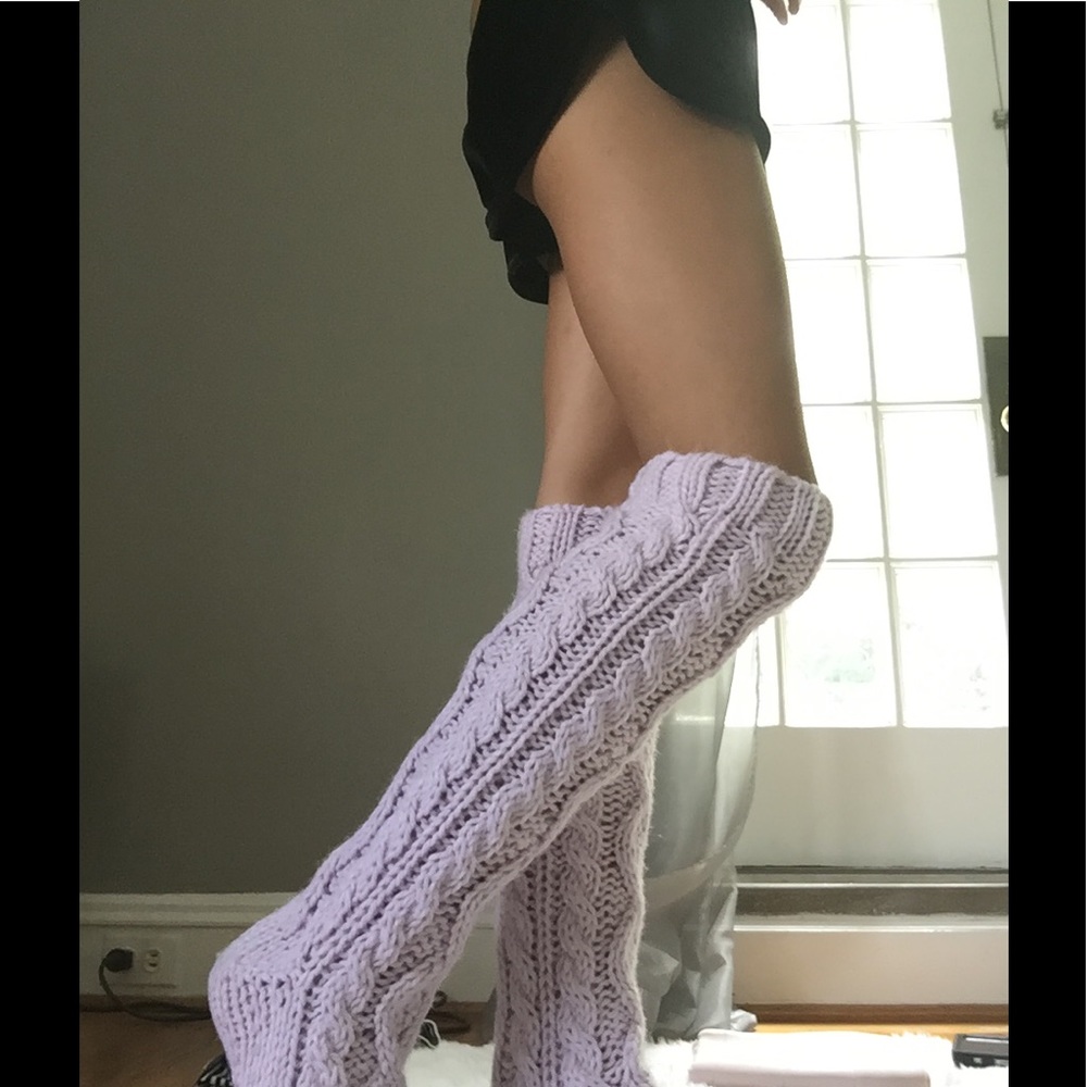 Lavender knit socks with grips on the bottom