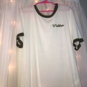 White top with green accents